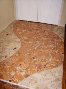 mosaic stone entryway, mosaic in foyer, stone, pebbles rock mosaic floor
